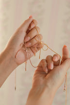 bow necklace in pink rose gold and gold finish 