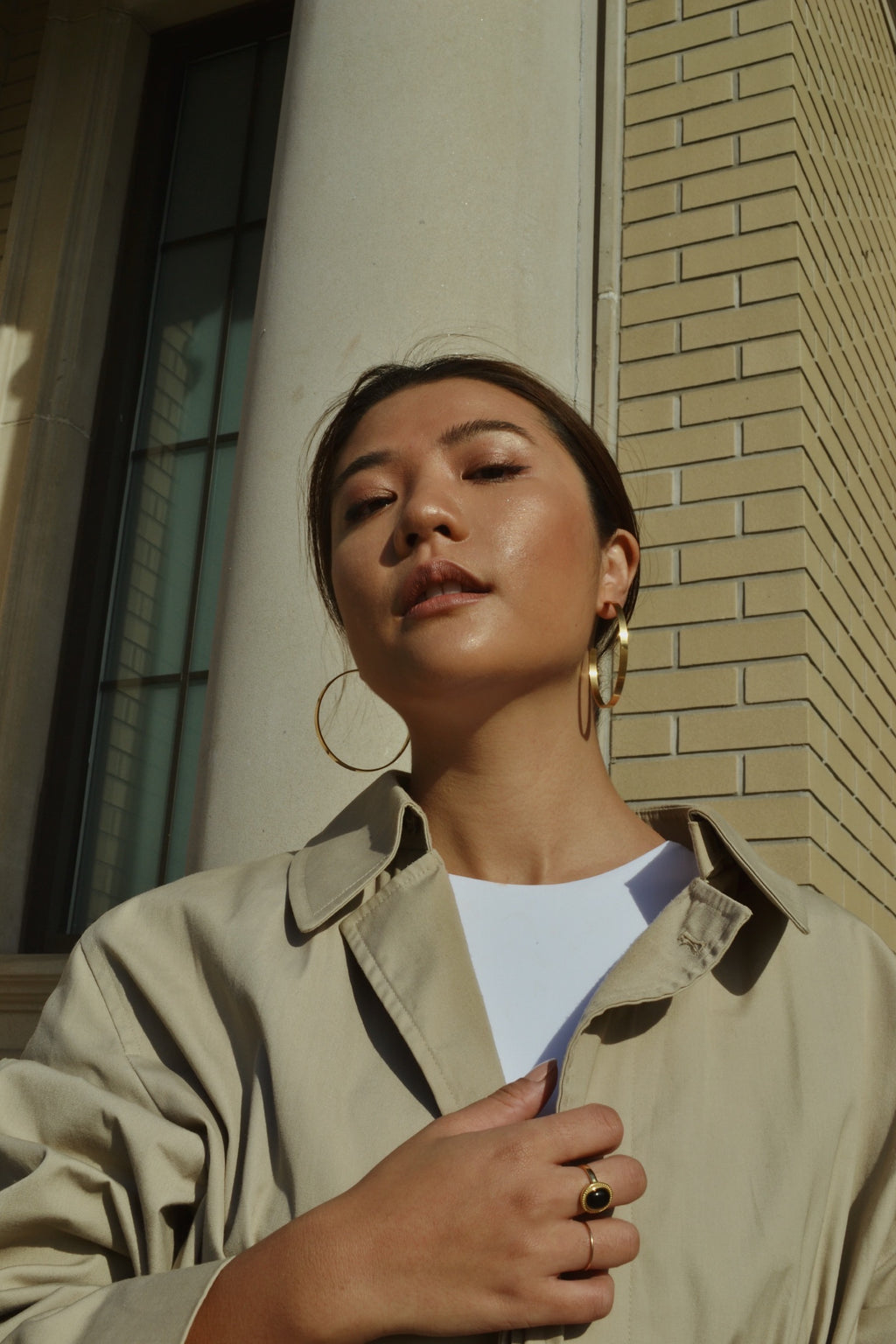 Large glossy gold hoop earrings in person